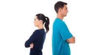 young couple having argument and turning their back on each other